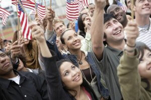 People Waving American Flags